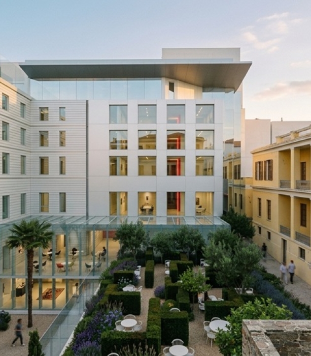 Concept render of a listed building development in Athens as a hospitality project. View of the garden space. Image copyright: Karydis & Associates.